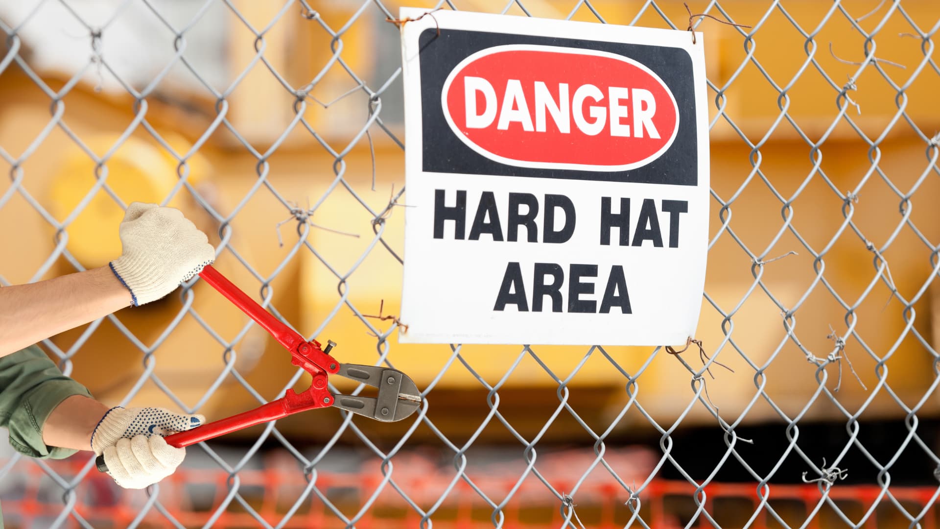 Construction site perimeter fence with security warning signage